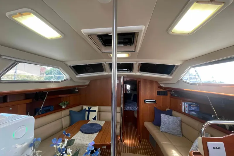 Slide: The Image of Interior of 2003 Hunter 426 Deck Salon yacht with cozy seating and elegant decor. - 103