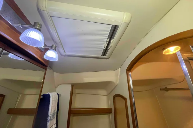 Slide: The Image of Interior of 2003 Hunter 426 Deck Salon, featuring ceiling lights and a skylight. - 111