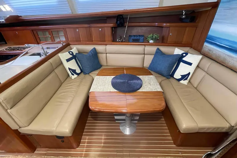 Slide: The Image of Luxurious interior of 2003 Hunter 426 Deck Salon with cozy seating and nautical decor. - 16
