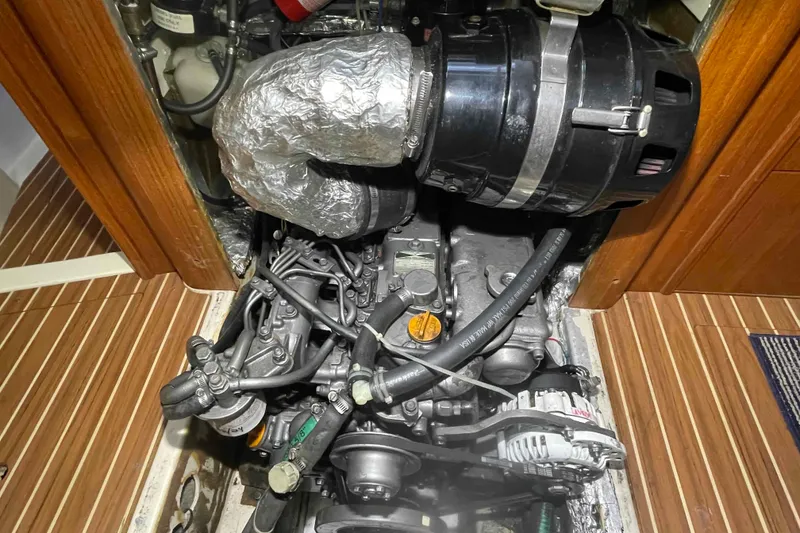 Slide: The Image of Engine compartment of 2003 Hunter 426 Deck Salon sailboat, showcasing mechanical components. - 18