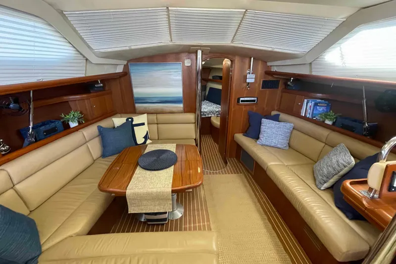 Slide: The Image of Luxurious interior of 2003 Hunter 426 Deck Salon with plush seating and elegant decor. - 30
