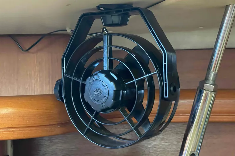 Slide: The Image of Small black fan mounted inside a 2003 Hunter 426 Deck Salon yacht. - 32