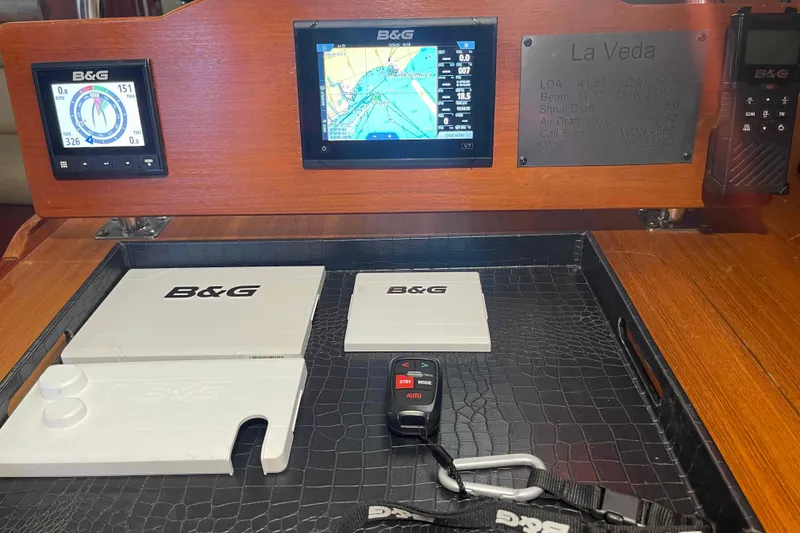 Slide: The Image of Navigation equipment on 2003 Hunter 426 Deck Salon, featuring B&G displays and controls. - 36