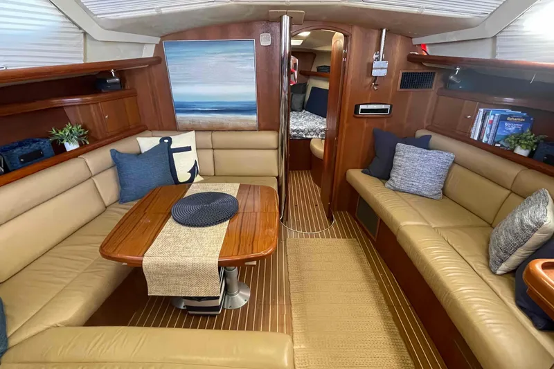 Slide: The Image of Luxurious interior of 2003 Hunter 426 Deck Salon yacht with cozy seating and elegant decor. - 4