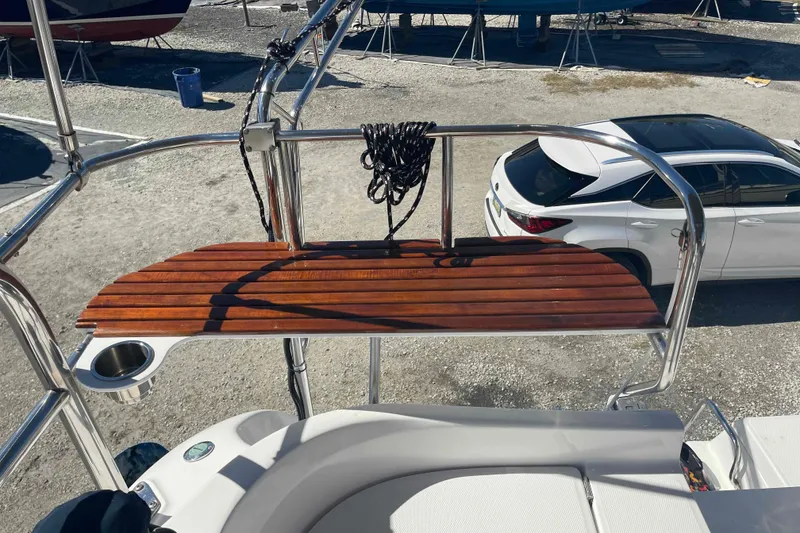 Slide: The Image of Hunter 426 Deck Salon 2003 yacht with wooden deck and stainless steel railing. - 45