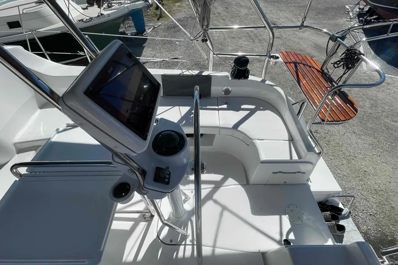Slide: The Image of Cockpit of 2003 Hunter 426 Deck Salon sailboat with navigation equipment and seating. - 46