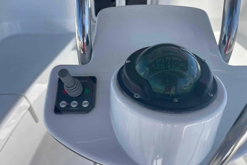 Slide: The Image of Control panel and compass on 2003 Hunter 426 Deck Salon yacht. - 49