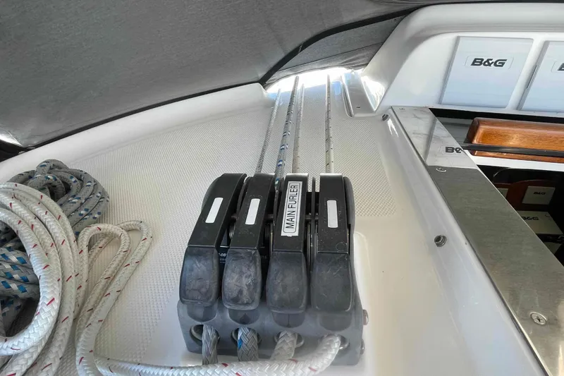 Slide: The Image of Deck controls and ropes on a 2003 Hunter 426 Deck Salon sailboat. - 58