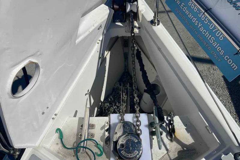 Slide: The Image of Anchor locker of 2003 Hunter 426 Deck Salon sailboat with chains and ropes. - 68