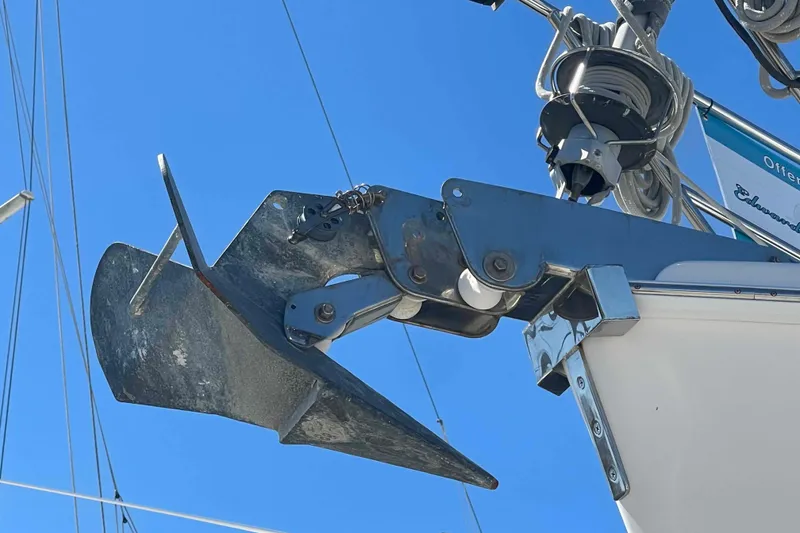 Slide: The Image of Anchor of 2003 Hunter 426 Deck Salon sailboat against clear blue sky. - 69