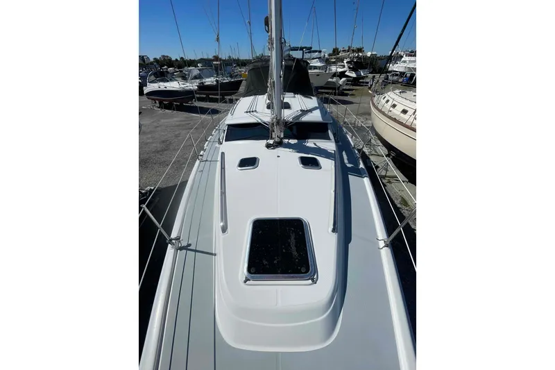 Slide: The Image of 2003 Hunter 426 Deck Salon sailboat on display at a marina. - 70