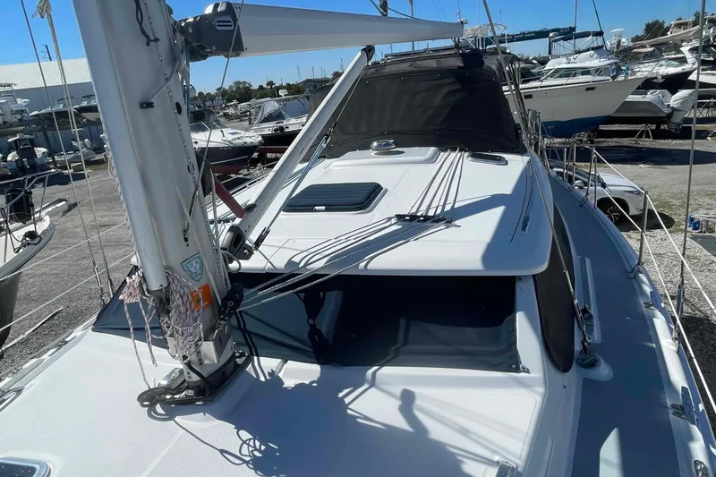 Slide: The Image of 2003 Hunter 426 Deck Salon sailboat on display at a marina. - 72