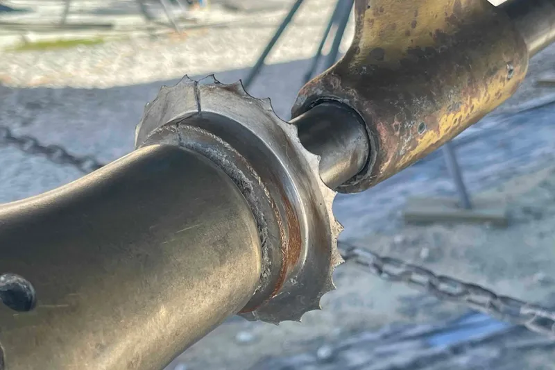 Slide: The Image of Close-up of a worn metal component on a 2003 Hunter 426 Deck Salon yacht. - 79