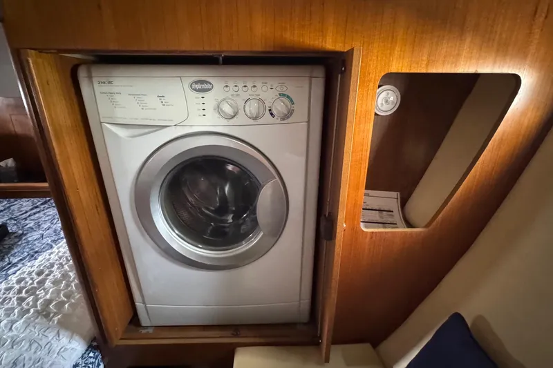 Slide: The Image of Built-in washing machine in 2003 Hunter 426 Deck Salon yacht interior. - 8