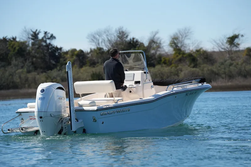 Slide: The Image of 2025 Grady-White Fisherman 180 boat cruising on calm water. - 12