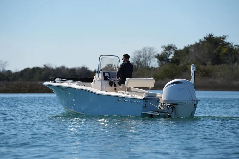 Slide: The Image of 2025 Grady-White Fisherman 180 boat cruising on calm water. - 13