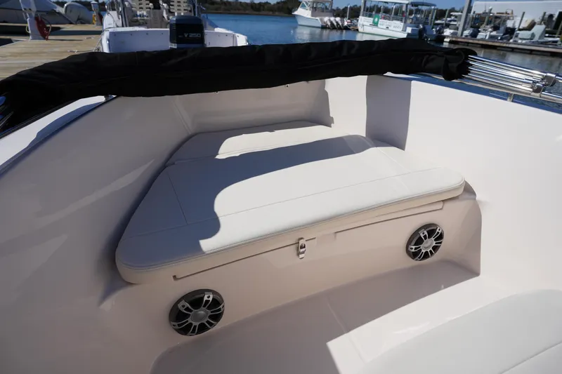 Slide: The Image of 2025 Grady-White Fisherman 180 boat interior with cushioned seating and speakers. - 29