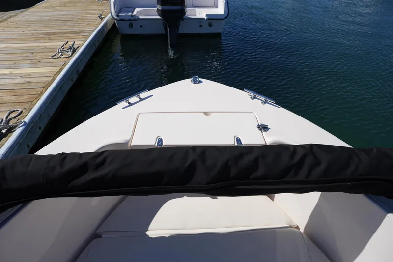 Slide: The Image of 2025 Grady-White Fisherman 180 boat docked, view from bow. - 31