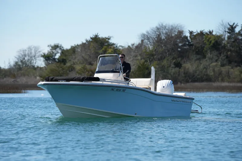 Slide: The Image of 2025 Grady-White Fisherman 180 boat cruising on a serene waterway. - 5