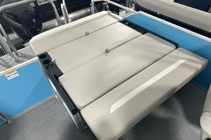 Slide: The Image of 2026 Godfrey EX 2286 SFLX boat interior with beige seating and cup holders. - 9