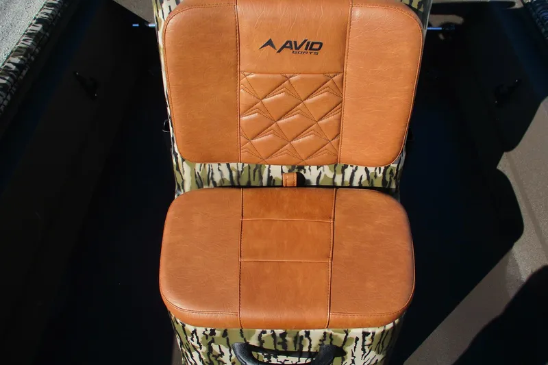 Slide: The Image of Avid 18 Rogue CC 2026 boat seat with brown leather and camouflage design. - 10