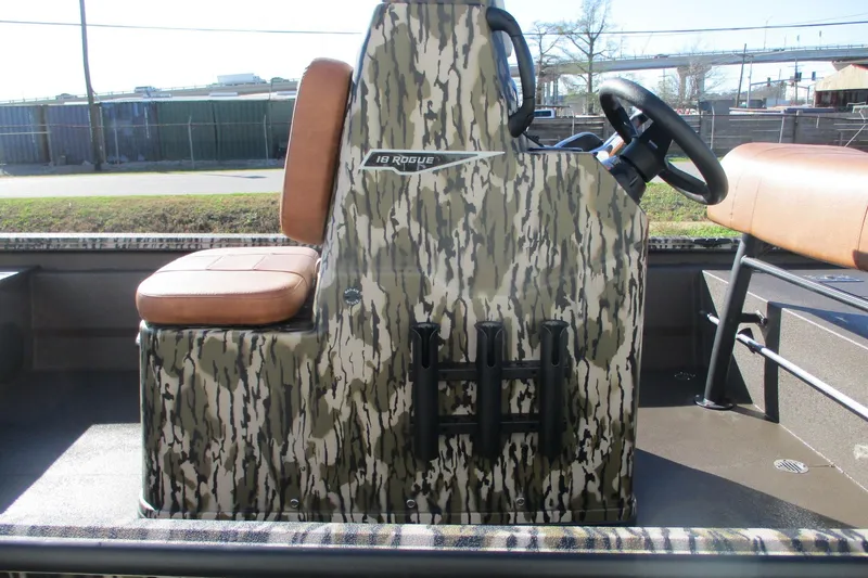 Slide: The Image of 2026 Avid 18 Rogue CC boat with camo design and brown seating. - 12