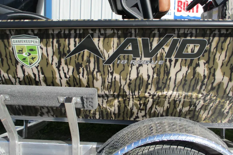 Slide: The Image of Avid 18 Rogue CC 2026 boat with camouflage design and Gamekeeper logo. - 16