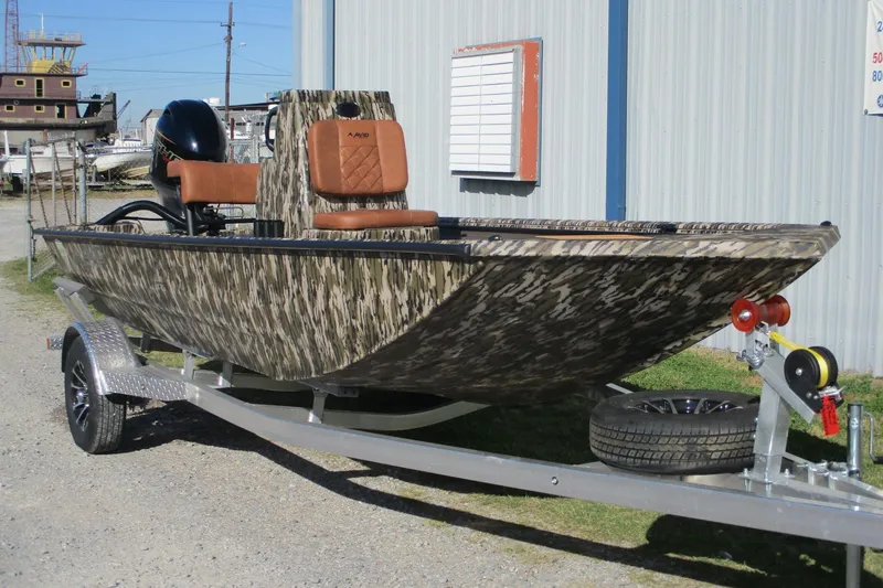Slide: The Image of 2026 Avid 18 Rogue CC boat with camouflage design on a trailer. - 3