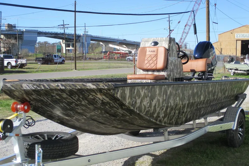 Slide: The Image of 2026 Avid 18 Rogue CC boat with camouflage design on a trailer. - 4