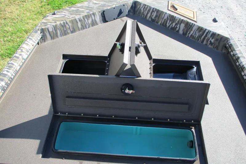 Slide: The Image of 2026 Avid 18 Rogue CC boat deck with open storage compartments. - 8