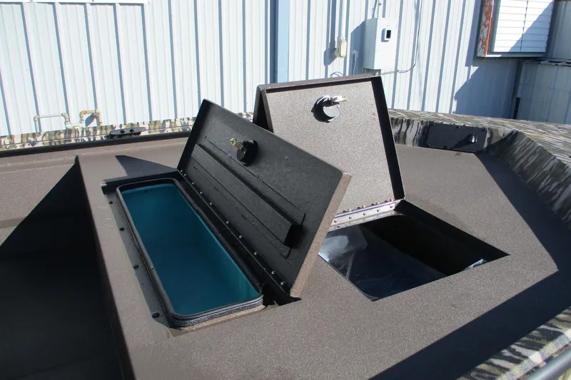 Slide: The Image of Open storage compartments on 2026 Avid 18 Rogue CC boat deck. - 9