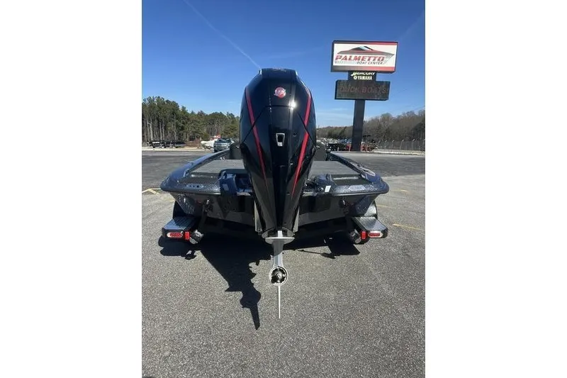 Slide: The Image of 2026 Phoenix 721 ZXL boat with powerful outboard motor, parked at Palmetto Boat Center. - 3