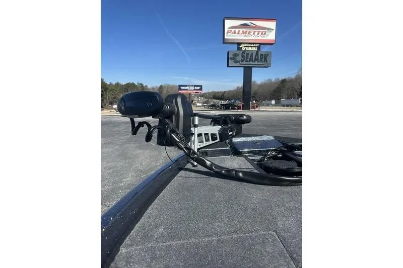 Slide: The Image of 2026 Phoenix 721 ZXL boat at Palmetto Boat Center with clear blue sky. - 9