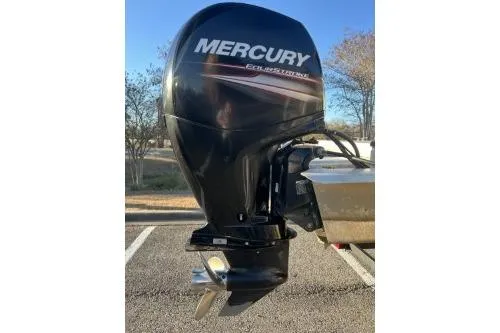 Slide: The Image of 2017 Sun Tracker Party Barge 24 DLX with Mercury outboard engine in a parking lot. - 10