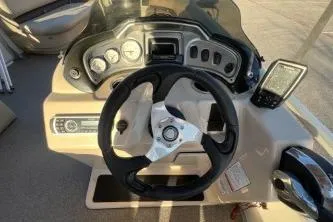 Slide: The Image of 2017 Sun Tracker Party Barge 24 DLX dashboard with steering wheel and controls. - 3
