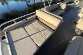 Slide: The Image of 2017 Sun Tracker Party Barge 24 DLX with spacious seating and scenic lake view. - 6