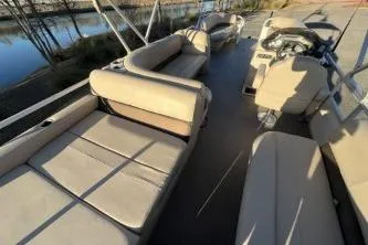 Slide: The Image of 2017 Sun Tracker Party Barge 24 DLX with spacious seating and steering console. - 8