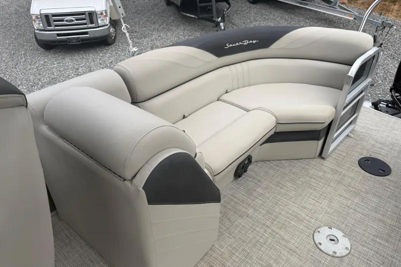 Slide: The Image of 2021 South Bay 222RS LE pontoon boat with beige seating and black accents. - 10
