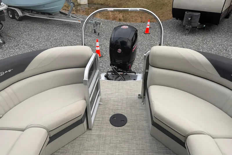 Slide: The Image of 2021 South Bay 222RS LE pontoon boat interior with seating and outboard motor. - 11