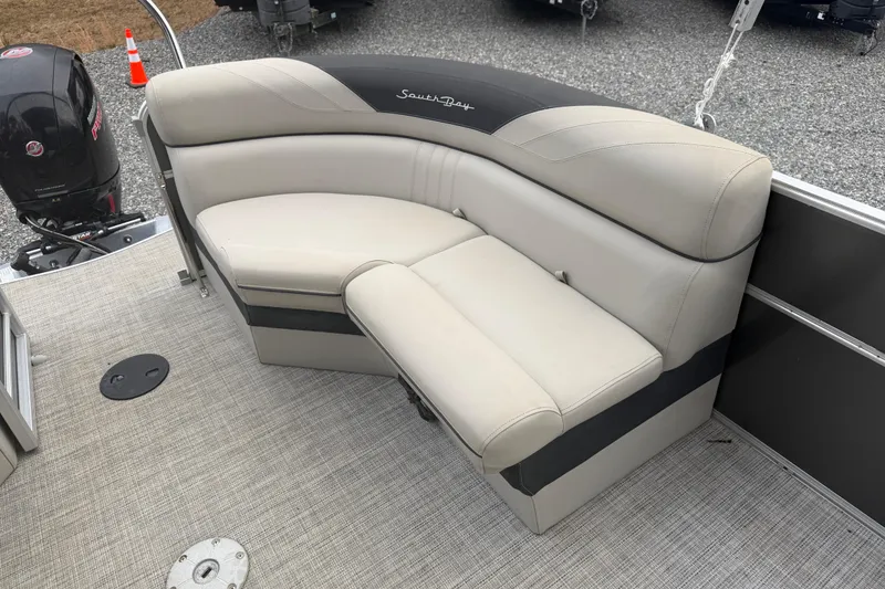 Slide: The Image of 2021 South Bay 222RS LE pontoon boat with beige seating and Mercury outboard motor. - 12