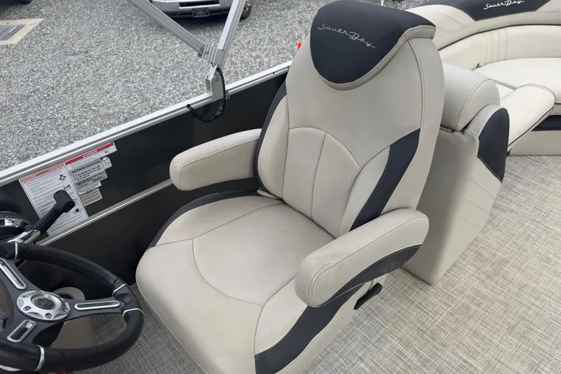 Slide: The Image of 2021 South Bay 222RS LE boat captain's chair with steering wheel, featuring sleek design. - 8