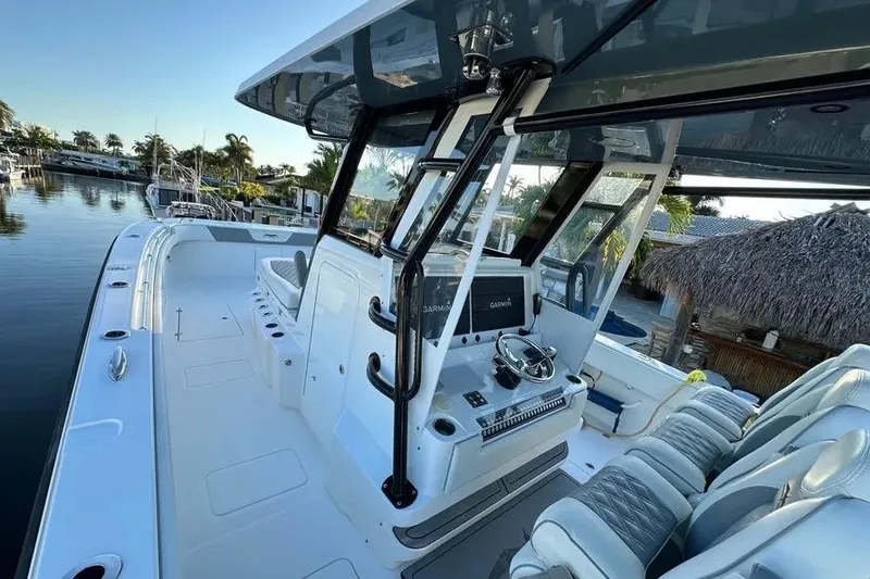 Slide: The Image of 2022 Invincible 35 Catamaran with sleek design and modern navigation equipment. - 11