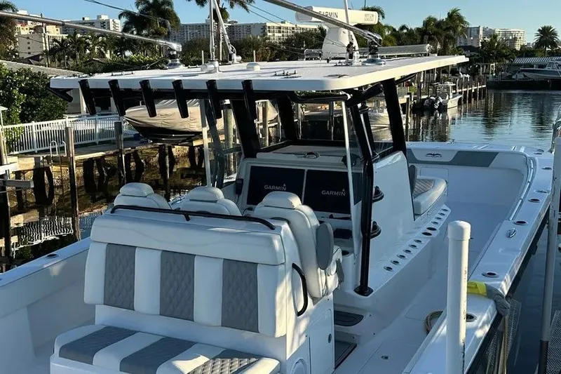 Slide: The Image of 2022 Invincible 35 Catamaran docked, featuring sleek design and modern equipment. - 13