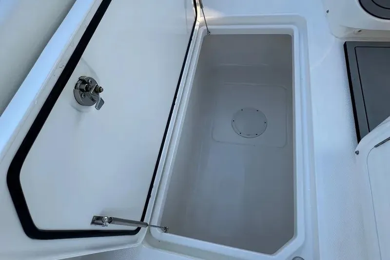 Slide: The Image of Open storage compartment on 2022 Invincible 35 Catamaran boat. - 24