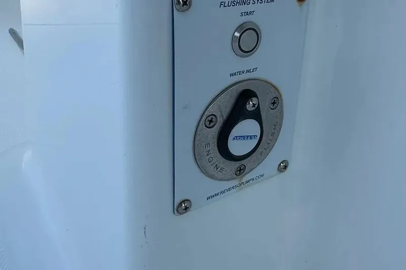 Slide: The Image of Flushing system panel on 2022 Invincible 35 Catamaran, featuring start button and water inlet. - 26
