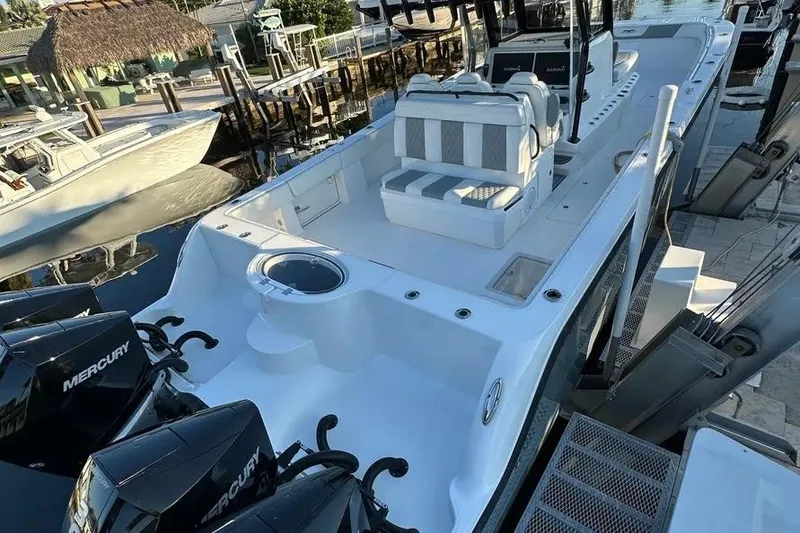 Slide: The Image of 2022 Invincible 35 Catamaran with Mercury engines docked at marina. - 37