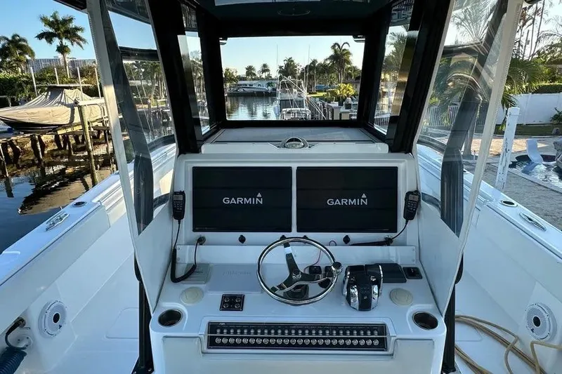 Slide: The Image of Cockpit of 2022 Invincible 35 Catamaran with Garmin displays and steering wheel. - 5