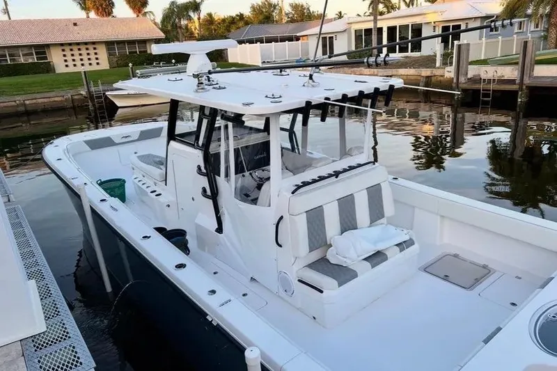 Slide: The Image of 2022 Invincible 35 Catamaran docked, featuring spacious deck and modern design. - 9