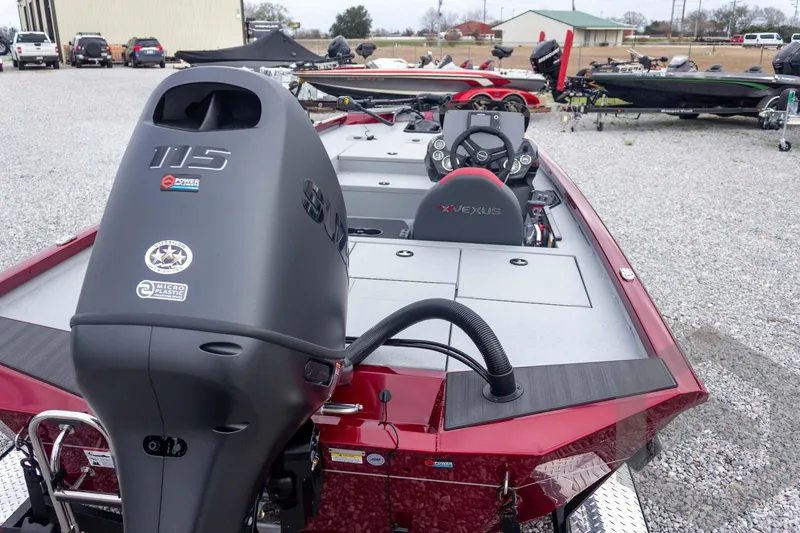 Slide: The Image of 2026 Vexus Defender 189 boat with powerful engine, sleek design, and modern dashboard. - 14