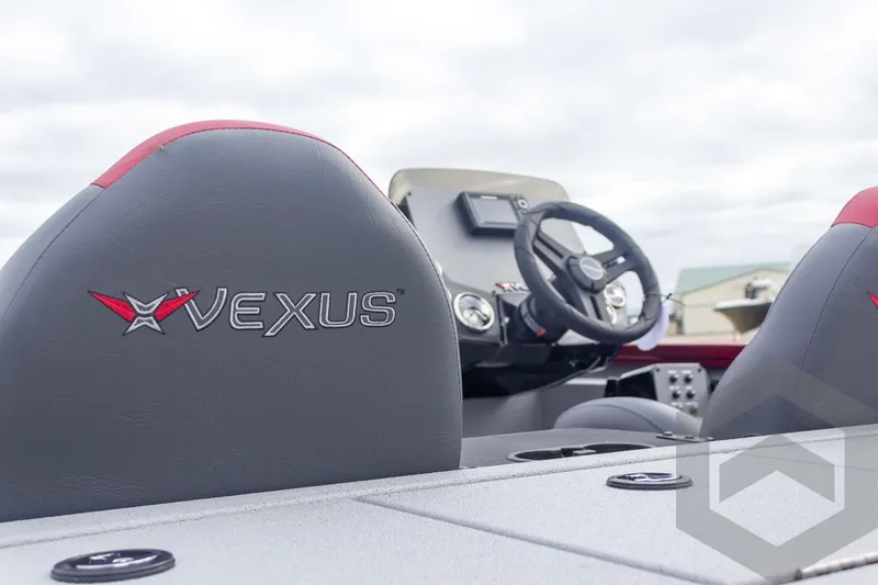 Slide: The Image of 2026 Vexus Defender 189 boat interior with steering wheel and branded seats. - 21